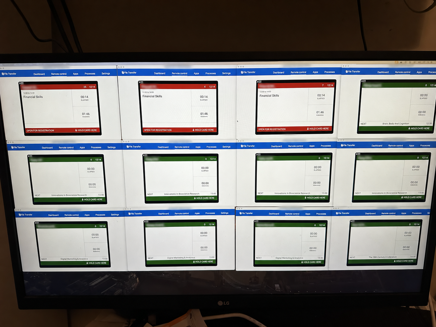 Multiple live attendance-device screens viewed remotely on one monitor